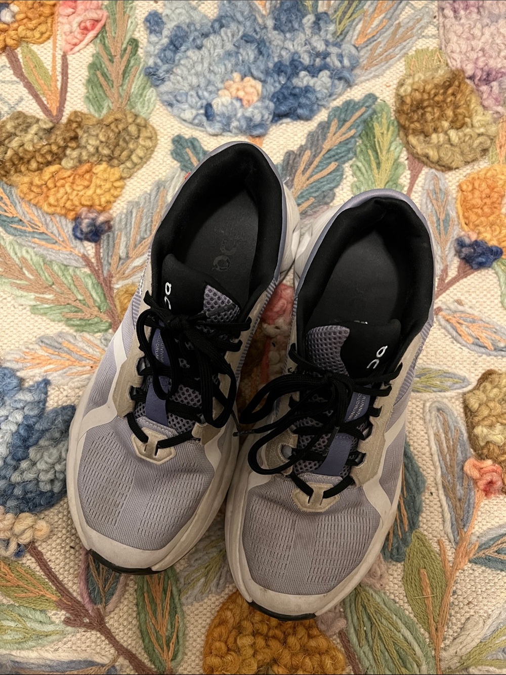 On running shoes (periwinkle, black, gray, white)